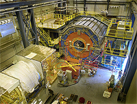 The PHENIX detector at Brookhaven National Laboratory's Relativistic Heavy Ion Collider (RHIC) records many different particles emerging from RHIC collisions, including photons, electrons, muons, and quark-containing particles called hadrons.