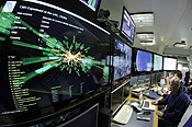 A graphic showing a collision at full power is pictured at the CMS experience control room of the LHC at the CERN in Meyrin. REUTERS/Denis Balibouse.