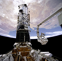 The Hubble Space Telescope stands tall in the cargo bay of the space shuttle Atlantis following its capture on Wednesday, May 13, 2009. Photo from NASA, and HUBBLESITE. NASA Images: http://www.nasaimages.org/index.html. HUBBLESITE: http://hubblesite.org/gallery/spacecraft/05/.