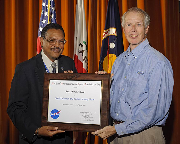Dr. David Koch accepting an honor award for the Kepler team from Lewis S. G. Braxton, III, NASA Ames’ deputy center director. Photo by NASA Ames