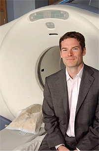 Lead author Oliver D. Howes and a P.E.T Scan Positron Emission Tomography (PET) machine.