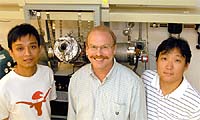 Professor Rodney Ruoff (center) is flanked by post-docs Weiwei Cai (left, a physicist) and Sungjin Park (right, a chemist).