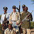 Tim White with Afar Police, Dallifage Camp, Middle Awash paleoanthropological study area, Afar desert, Ethiopia, 2006.