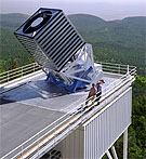The SDSS telescope. Photo credit: Fermilab Visual Media Services. The 2.5-meter reflecting telescope of the Sloan Digital Sky Survey. The box-like structure protects the separately mounted telescope from being buffeted by the wind.