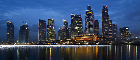 Singapore's central business district is pictured at dusk, December 30, 2009. REUTERS/Tim Chong.