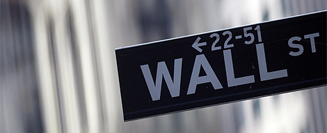 A street sign is seen outside the New York Stock Exchange in New York, New York. REUTERS/Eric Thayer.